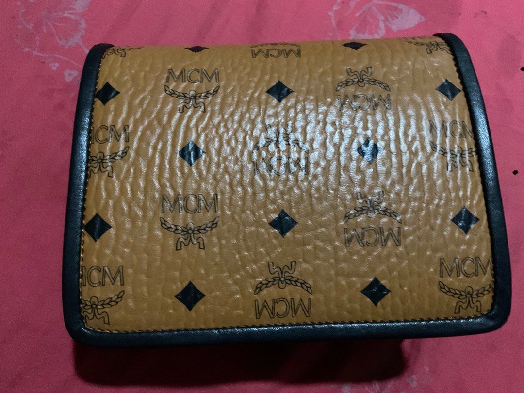 MCM Patricia Cross body bag (Category: Luxury Bags & Wallets) located in Quezon City. Submitted by challizomorog (Listing ID 1287797495, Image 3). Description: MCM Patricia cross body bag Two way 100% Gold hardware with white tag turnable screws In cognac and black with MCM dust bag RFS: Bought MCM Toni Mini shopper.