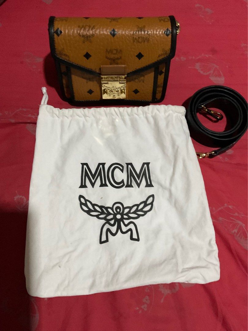 MCM Patricia Cross body bag (Category: Luxury Bags & Wallets) located in Quezon City. Submitted by challizomorog (Listing ID 1287797495, Image 1). Description: MCM Patricia cross body bag Two way 100% Gold hardware with white tag turnable screws In cognac and black with MCM dust bag RFS: Bought MCM Toni Mini shopper.
