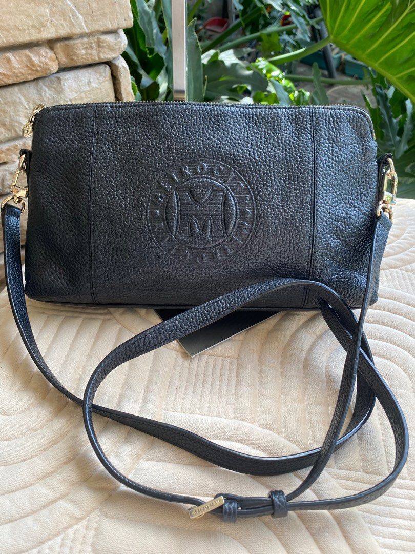 METROCITY Sling Bag (Category: Luxury Bags & Wallets) located in Baliuag. Submitted by nylinel (Listing ID 1287904654, Image 1). Description: Material in soft leather Size: L- 11” x H- 6.5” x W- 2” Guaranteed original 💯 In good condition .