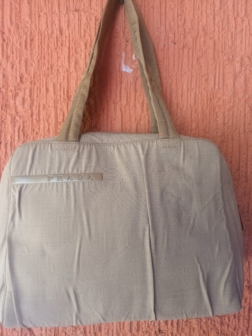 Preloved Prada Nylon Sport Handbag (Category: Luxury Bags & Wallets) located in Mandaluyong City. Submitted by keanqd (Listing ID 1287693529, Image 1). Description: Prada Nylon Sport Handbag with Padlock Authentic with some crumpled- nalabhan ko kasi siya a little stains h-9 inches l- 12 inches w- 2.5 inches shipping c/o buyer.