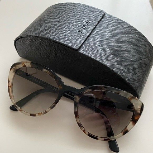 Auth Prada shades in mint condition (Category: Sunglasses & Eyewear) located in Paranaque City. Submitted by egg_shells (Listing ID 1288022405, Image 1). Description: Bought this in Prada Tokyo last year for almost 16k and was worn only few times Authentic Prada tortoise shell cat eye sunglasses in mint condition, Rank 9.5/10 Includes hard case..missing cloth. rfs: unfortunately I have to use progressive Eyewear due to age so wearing shades is ha