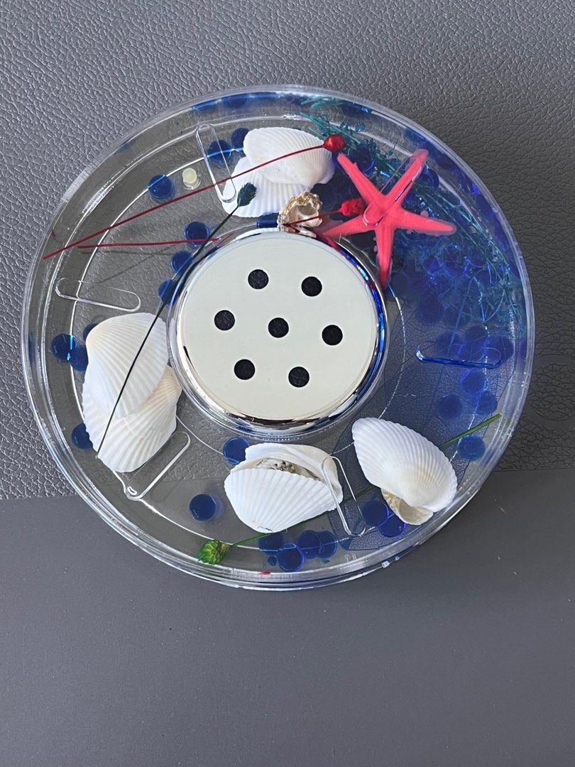 Bathroom Set (Category: Other Home Decor) located in Singapore. Submitted by miumiutay (Listing ID 1287940974, Image 1). Description: Seashells, flowers, leaves in between wall of containers filled with water, moves along when container is moved..