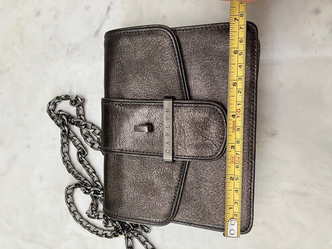 Carlyn Mettalic Mini Sling Bag (Category: Cross-body Bags) located in Manila. Submitted by zolnak (Listing ID 1287948751, Image 3). Description: Korean branded chain sling bag. Gunmetal hardware. Removable chain sling strap. Magnetic closure. Material is scratch and crack resistant. Nice for events/evening wear. Also good for casual use. Buyer to shoulder shipping. .
