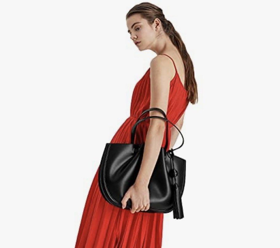 Charles and Keith Tassel tote bag (Category: Tote Bags) located in Manila. Submitted by yourstrulyeli (Listing ID 1288123081, Image 1). Description: 💗💯 Guaranteed Authentic 💗 Store bought 💗 Like new 💗 Bought for 6k+ 💗 Used twice only 💗 Free shipping within metro manila.