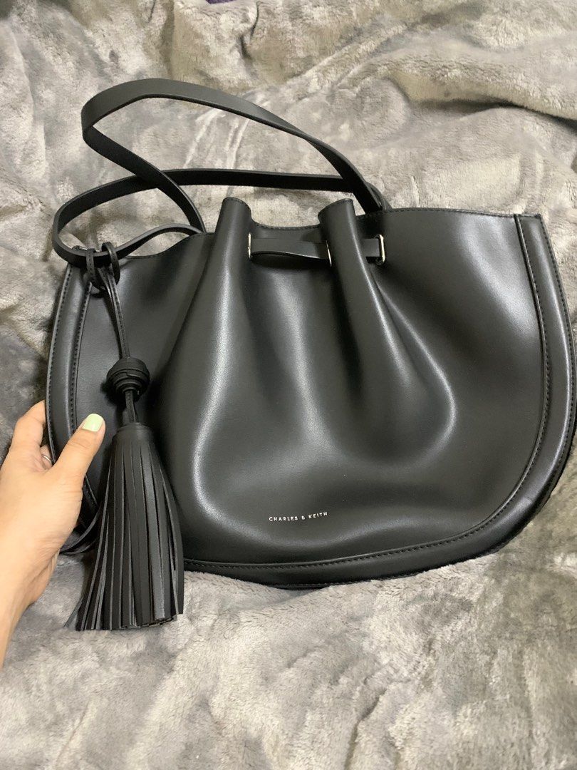 Charles and Keith Tassel tote bag (Category: Tote Bags) located in Manila. Submitted by yourstrulyeli (Listing ID 1288123081, Image 3). Description: 💗💯 Guaranteed Authentic 💗 Store bought 💗 Like new 💗 Bought for 6k+ 💗 Used twice only 💗 Free shipping within metro manila.