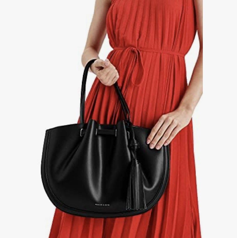 Charles and Keith Tassel tote bag (Category: Tote Bags) located in Manila. Submitted by yourstrulyeli (Listing ID 1288123081, Image 2). Description: 💗💯 Guaranteed Authentic 💗 Store bought 💗 Like new 💗 Bought for 6k+ 💗 Used twice only 💗 Free shipping within metro manila.