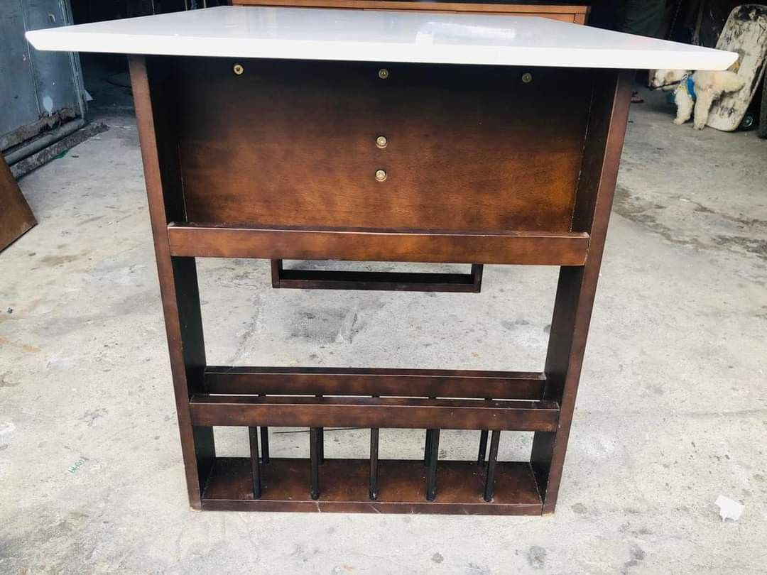 Expendable table (Category: Tables & Sets) located in Quezon City. Submitted by matetdevis13 (Listing ID 1287913030, Image 2). Description: White extendable table Price 4200 29 1/2 / 36L x 29 1/2W x 27 1/2H inches With side magazine rack In good condition Code akc 906.