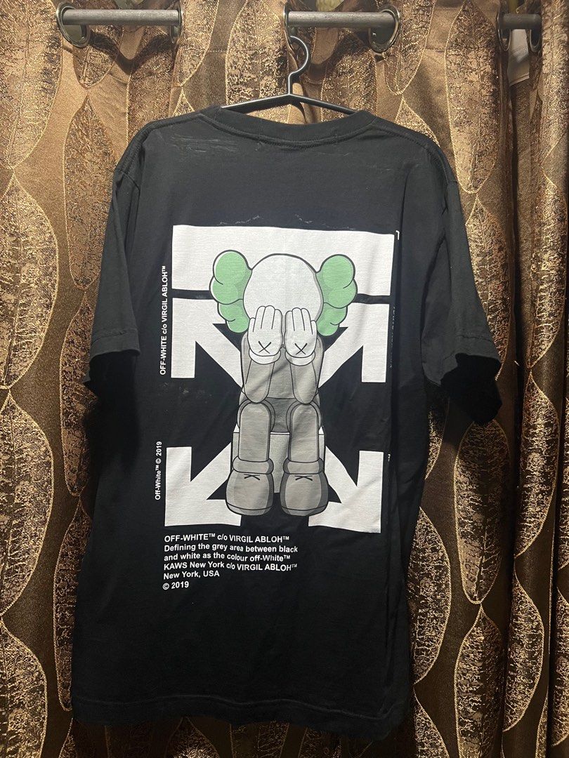 Kaws Off-White Black Shirt (Category: Tshirts & Polo Shirts ) located in Mandaluyong City. Submitted by eldrin (Listing ID 1287939864, Image 2). Description: Width 21” Length 29.5” With washable stains Via courier/delivery only.