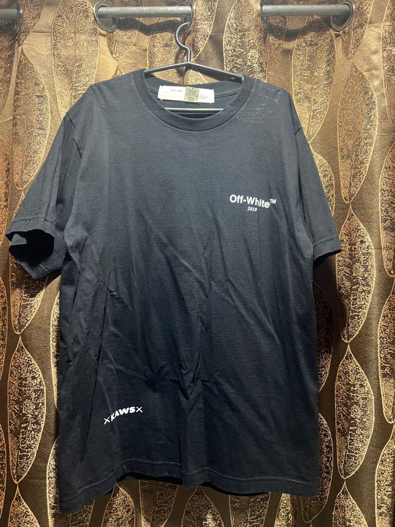 Kaws Off-White Black Shirt (Category: Tshirts & Polo Shirts ) located in Mandaluyong City. Submitted by eldrin (Listing ID 1287939864, Image 1). Description: Width 21” Length 29.5” With washable stains Via courier/delivery only.