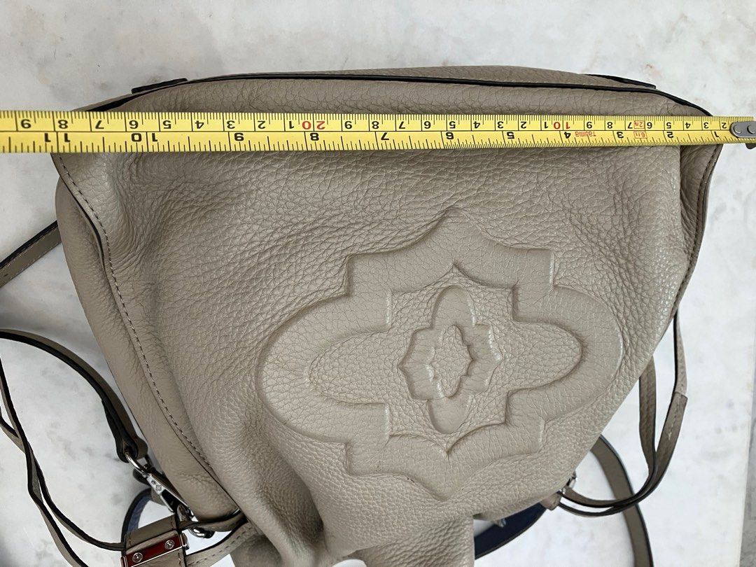 Oryany Leather Bucket Shoulder Sling Bag (Category: Cross-body Bags) located in Manila. Submitted by zolnak (Listing ID 1287927056, Image 3). Description: Very good condition. Real cream soft pebbled leather. Imported brand. Drawstring with metal locking hardware. All silver hardware in almost perfect condition. With short handle and adjustable sling strap. Additional punched strap hole. Minimal small unnoticeable stain as shown in photos. Cute c