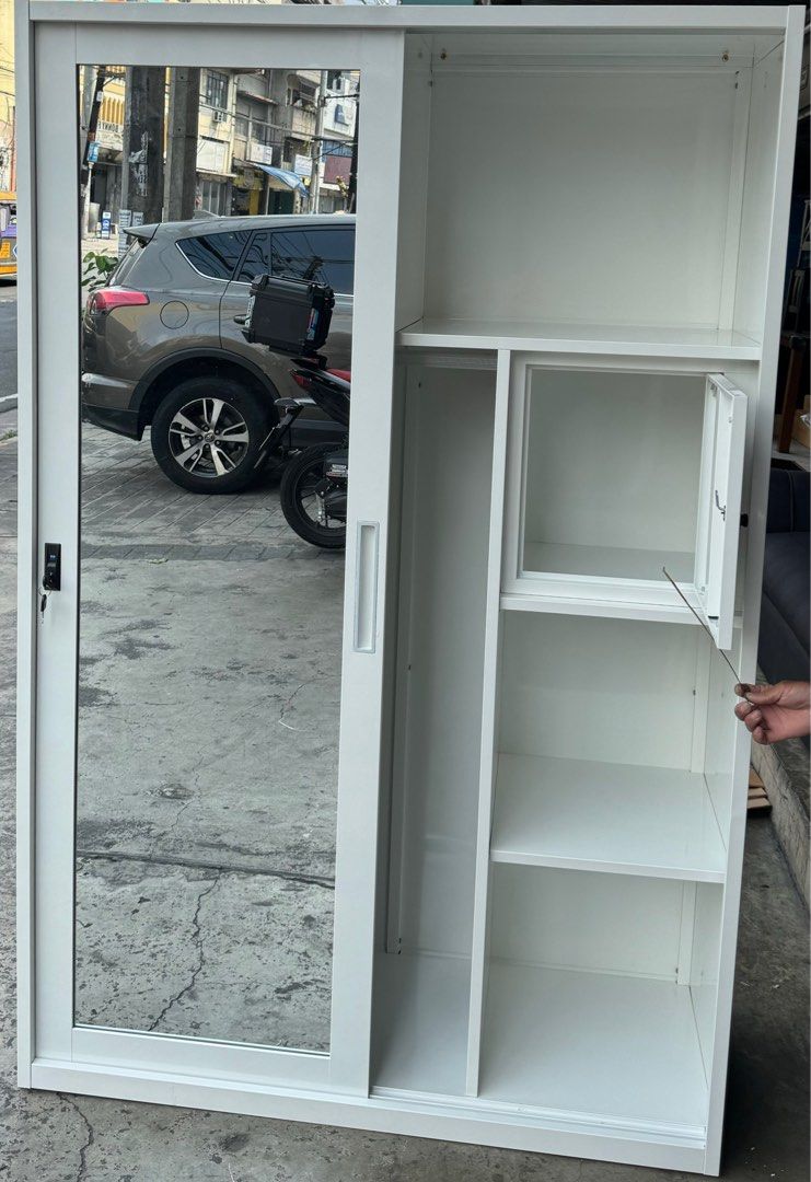 Sliding Cabinet with Mirror (Category: Shelves, Cabinets & Racks) located in Manila. Submitted by michaelpchua33 (Listing ID 1287944845, Image 3). Description: Sliding Door Cabinet with mirror and safety vault Color: Light Gray Dimensions: W 120cm D 50cm H 185cm Rust proof Heavy duty cold rolled steel plate .