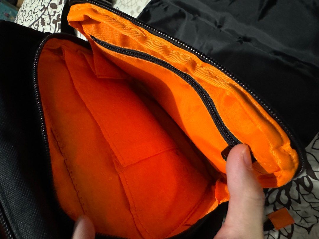 VAULV ESSENTIAL 012 (BLACK-ORANGE) (Category: Sling Bags) located in Cavite. Submitted by jaybee28 (Listing ID 1288043360, Image 3). Description: VAULV ESSENTIAL 012 (BLACK-ORANGE) The VAULV Essential 012 is the go-to side bag perfect for your active lifestyle. It has two main compartments where each has its own respective pockets to help further organize your essentials. Below are the features of the VAULV Essential 012: First Main Compartment Z