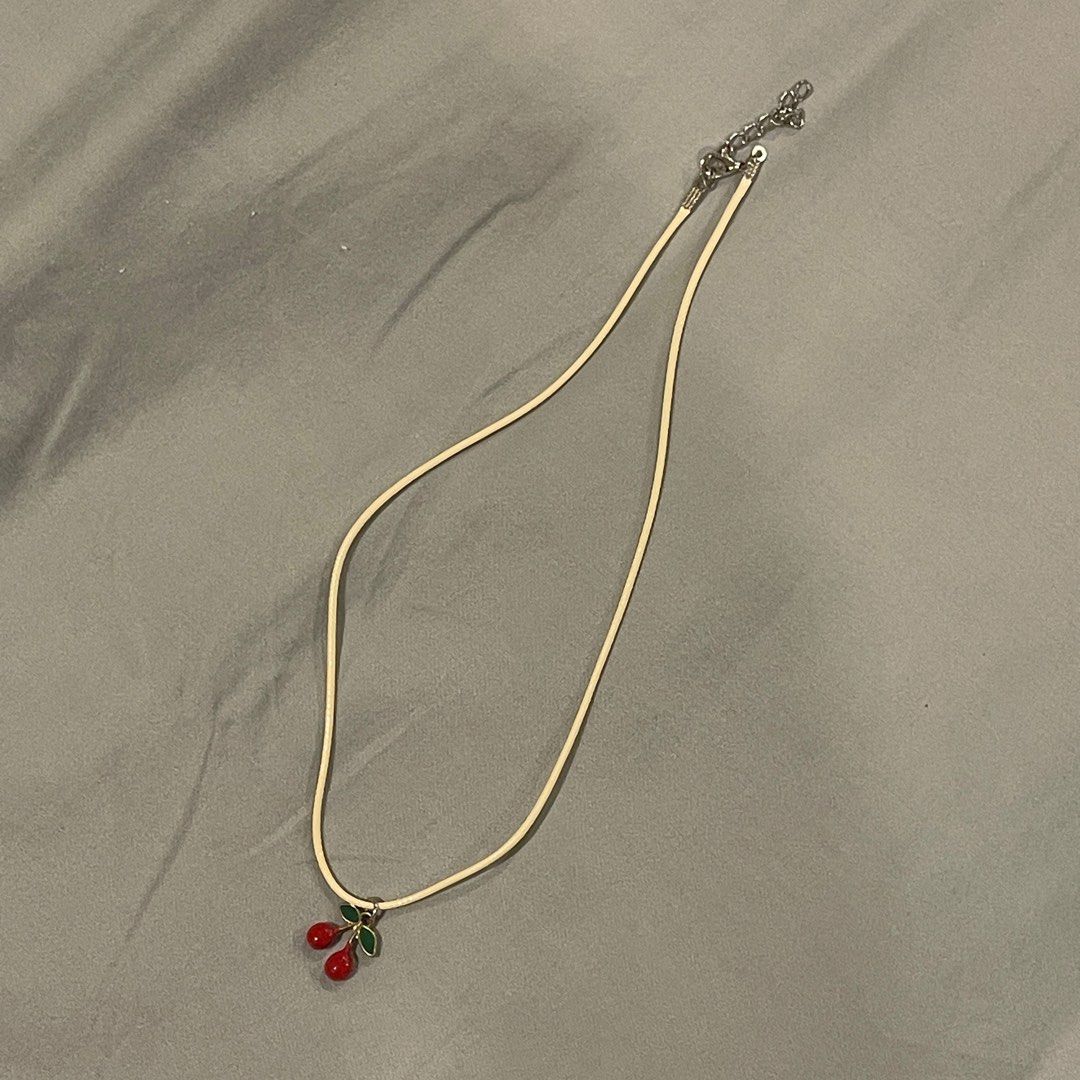 White and red cherry necklace (Category: Necklaces) located in Makati City. Submitted by dingustts (Listing ID 1287913608, Image 1). Description: White string necklace with red cherry charm! RFS: Impulse buy 😅.
