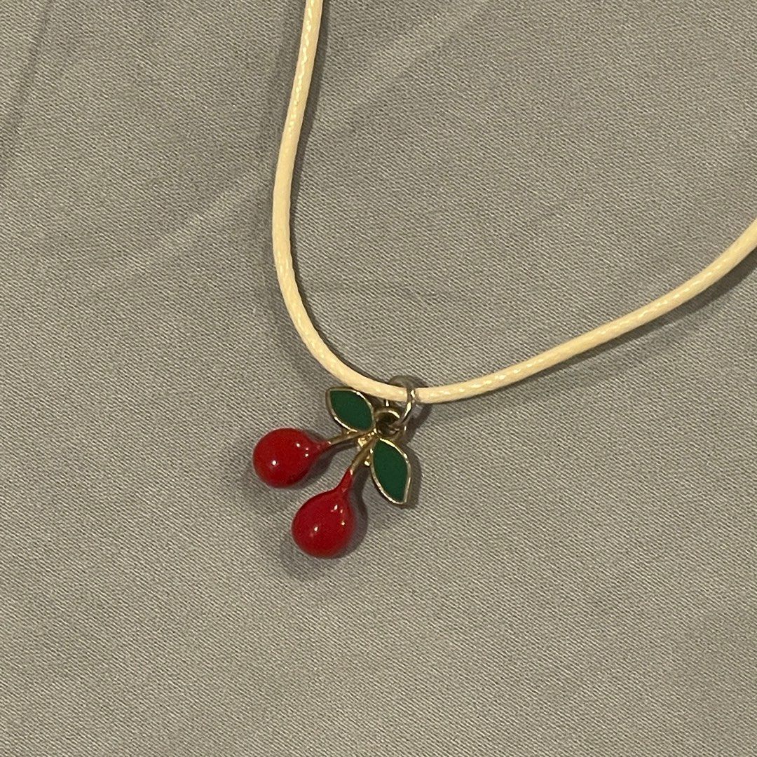 White and red cherry necklace (Category: Necklaces) located in Makati City. Submitted by dingustts (Listing ID 1287913608, Image 2). Description: White string necklace with red cherry charm! RFS: Impulse buy 😅.