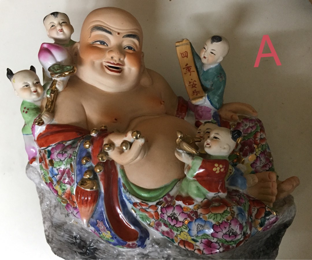 Laughing buddha statues A B C