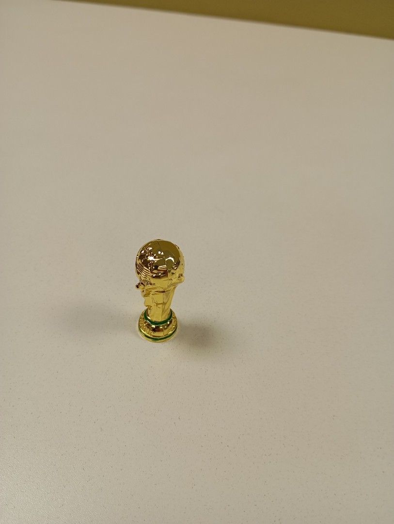 Mini trophy (Category: Toy Figures) located in Singapore. Submitted by uncle_man (Listing ID 1283678072, Image 1). Description: 1. world cup - HT:4cm WT: 250g to 350g est -$10 1. EPL cup - HT:5cm WT: 350g to 450g est - $10.