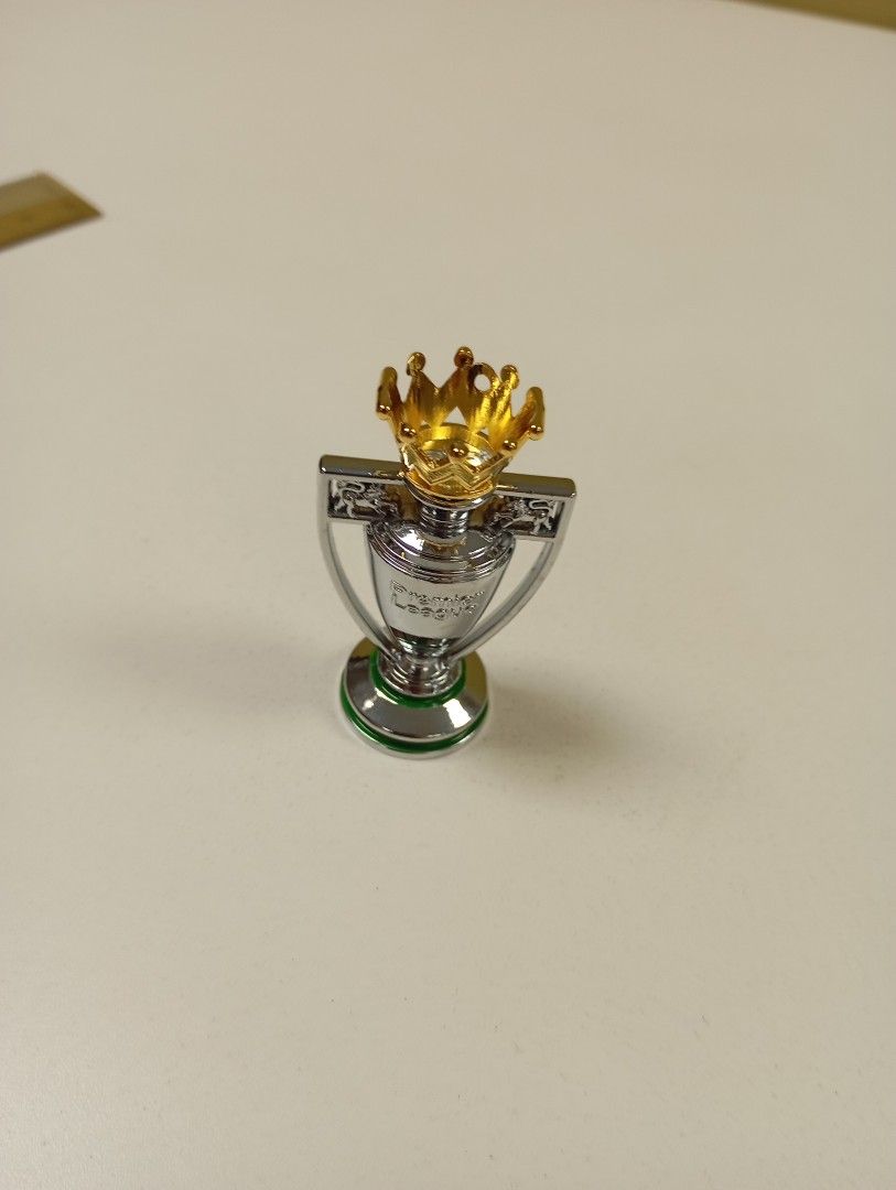 Mini trophy (Category: Toy Figures) located in Singapore. Submitted by uncle_man (Listing ID 1283678072, Image 2). Description: 1. world cup - HT:4cm WT: 250g to 350g est -$10 1. EPL cup - HT:5cm WT: 350g to 450g est - $10.