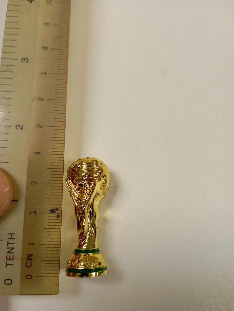 Mini trophy (Category: Toy Figures) located in Singapore. Submitted by uncle_man (Listing ID 1283678072, Image 3). Description: 1. world cup - HT:4cm WT: 250g to 350g est -$10 1. EPL cup - HT:5cm WT: 350g to 450g est - $10.