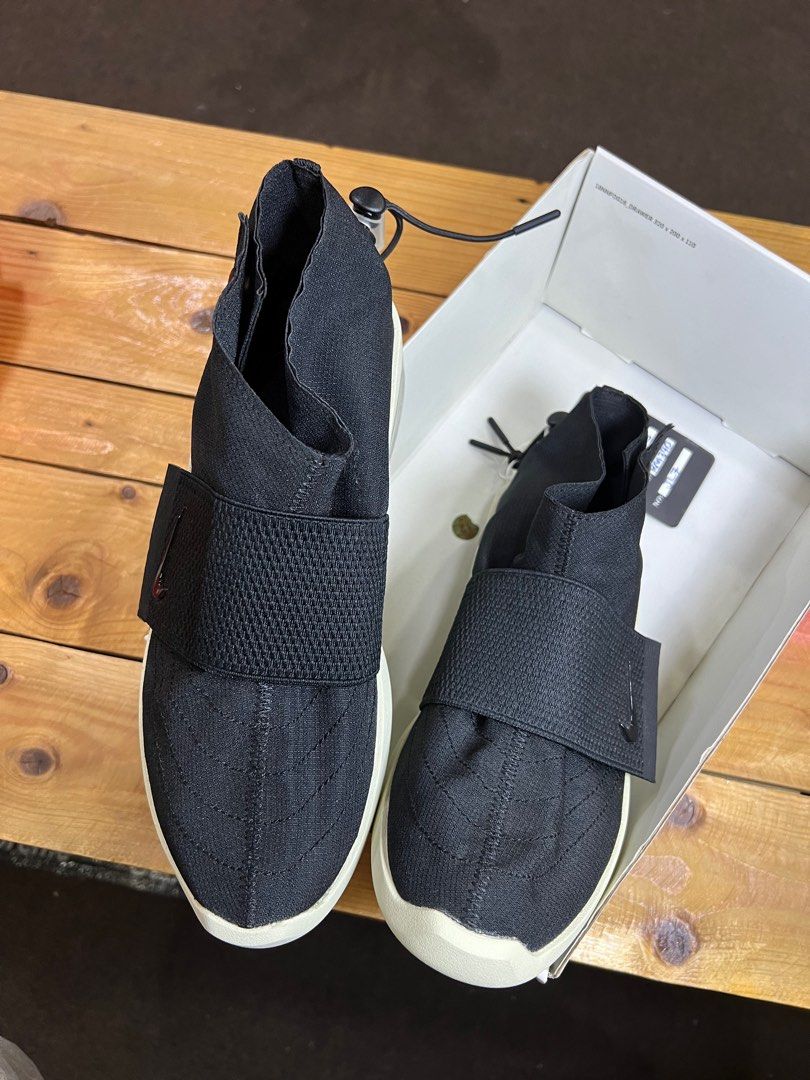 fear of god moccasin black on feet