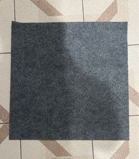 Self adhesive carpet tile