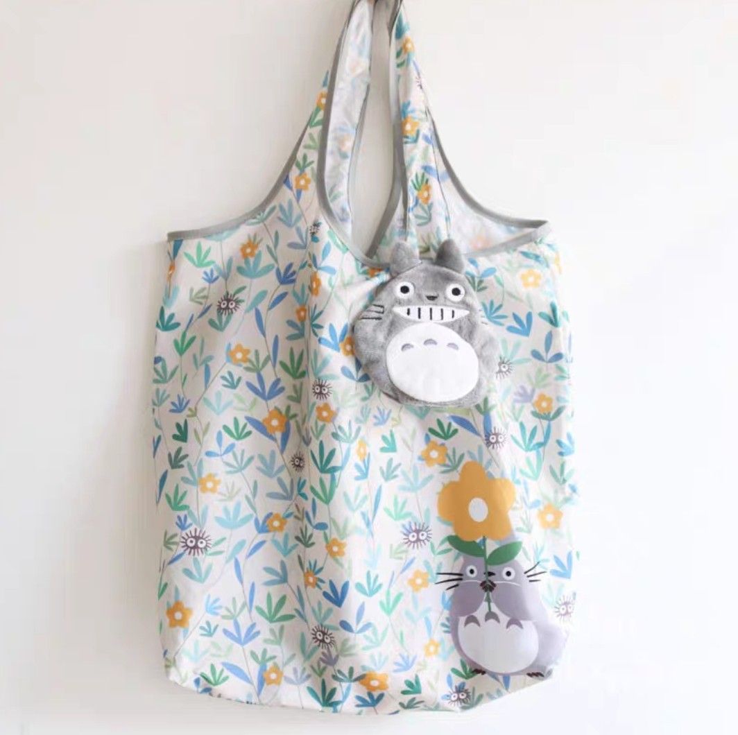 (Ready Stock from Japan 🇯🇵 ) Studio Ghibli Totoro - Grinning Grey Totoro Plush with Zip, Eco Tote Bag Contained within the Plush Toy Keychain (Category: Babies & Kids Fashion) located in Singapore. Submitted by oddball.fishes (Listing ID 1283694483, Image 1). Description: Ready Stock from Japan 🇯🇵 Studio Ghibli Totoro - Grinning Grey Totoro Plush with Zip, Tote Bag Contained within the Plush Toy Keychain Max. Load: 10kg.