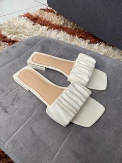 White slip-on sandals