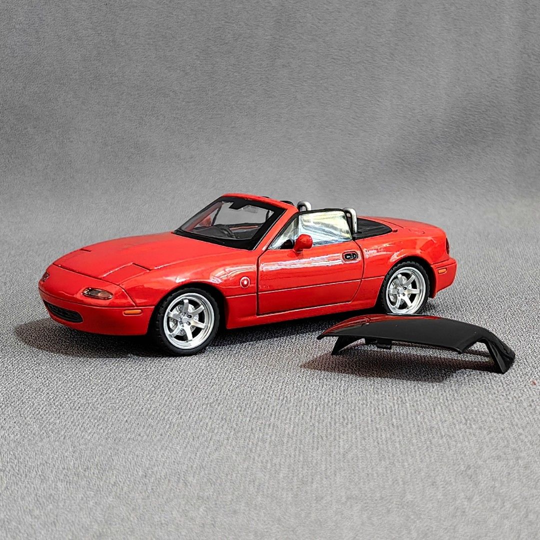 1/32 Mazda MX-5 Miata NA Diecast Scale Model (Category: Vehicle & Diecast Models) located in Antipolo. Submitted by blueandyellow (Listing ID 1288246186, Image 2). Description: Red Miata New Color Variant! 1/32 Mazda MX-5 Miata NA Diecast Scale Model Diecast Metal Body, Rubber Tires and Plastic Accessories 1/32 scale ~ Approximately 6 inches in length Opening Doors, Hood and Trunklid Working Head Lights and Tail Lights Poseable Front Wheels Worki
