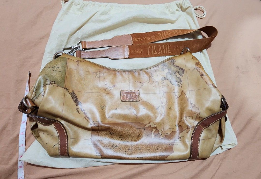 Alviero Martini shoulder bag (Category: Luxury Bags & Wallets) located in Cebu City. Submitted by rhea20ph (Listing ID 1288416983, Image 2). Description: pre loved item medium to semi large size glossy leather material guitar strap normal signs of wear plus sf.