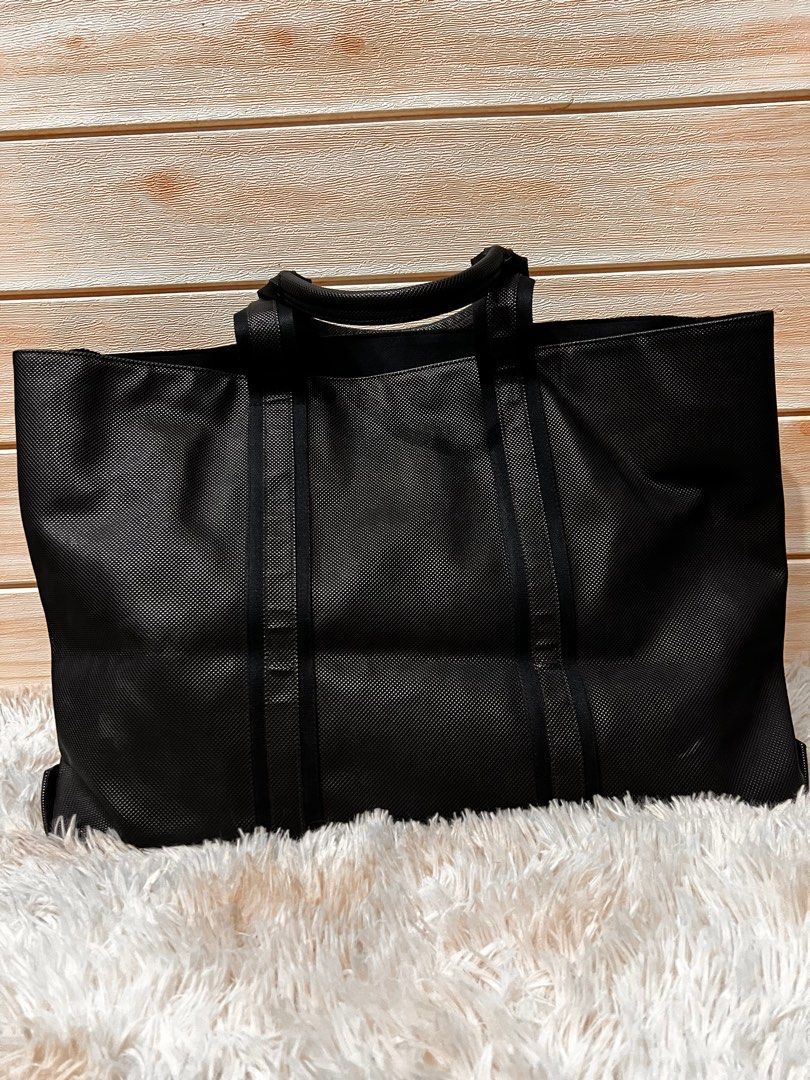 Authentic Bottega Veneta Black Tote Bag (Category: Luxury Bags & Wallets) located in Cagayan de Oro. Submitted by riggstuffs (Listing ID 1288383253, Image 1). Description: Guaranteed Authentic Bottega Veneta Tote Bag Made of pvc material with leather trimming With tag Open tote, clean interior and exterior areas Dimension: H13”x L 21”x Depth 8” Handle drop 7” Disclaimer: Riggstuffs is not associated with the brand posted. All copyrights and trade