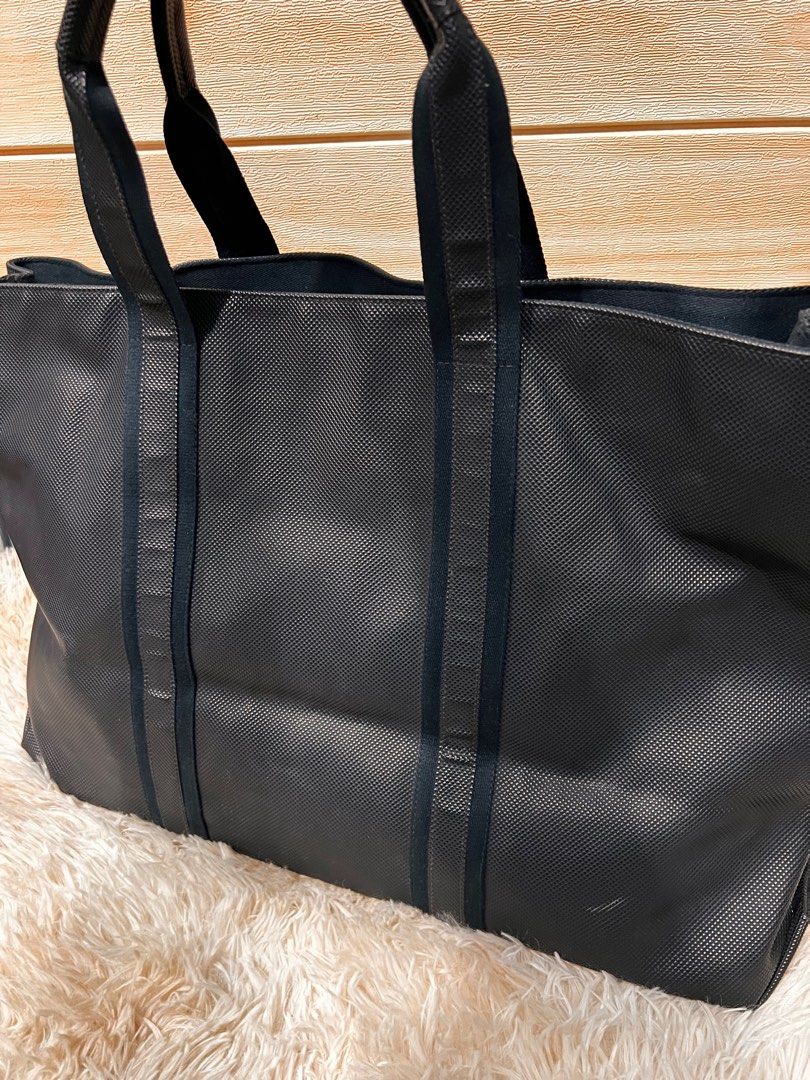 Authentic Bottega Veneta Black Tote Bag (Category: Luxury Bags & Wallets) located in Cagayan de Oro. Submitted by riggstuffs (Listing ID 1288383253, Image 2). Description: Guaranteed Authentic Bottega Veneta Tote Bag Made of pvc material with leather trimming With tag Open tote, clean interior and exterior areas Dimension: H13”x L 21”x Depth 8” Handle drop 7” Disclaimer: Riggstuffs is not associated with the brand posted. All copyrights and trade