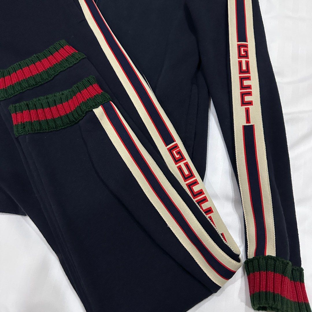 Gucci Jacquard Track Suit (Category: Coats, Jackets and Outerwear) located in Quezon City. Submitted by ishdeclutters (Listing ID 1288361678, Image 2). Description: Condition: 9/10 Color: Navy Blue, Red-Green Stripes Size: XS-S Womens / Teens 12 Material: Organic Cotton Long Sleeves, Ribbed Cuffs, Logo print at shoulder, signature web stripe trim Brand Style ID: 497307X9L52.