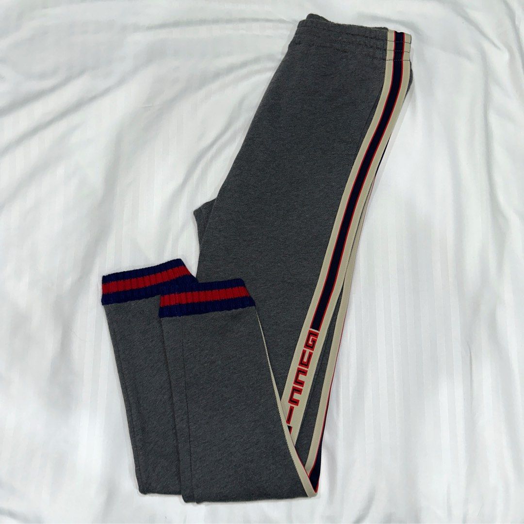 Gucci Logo Stripe Joggers (Category: Activewear) located in Quezon City. Submitted by ishdeclutters (Listing ID 1288364130, Image 1). Description: Condition: 9/10 Color: Grey with Blue-Red Stripes Size: XS-S Womens / Teens 12 Brand Style ID: 497950X9L52.