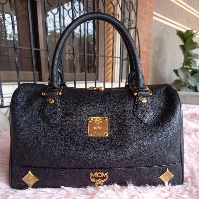 MCM Leather Doctors Bag (Category: Luxury Bags & Wallets) located in Guagua. Submitted by WearDTwinsCollections (Listing ID 1288322979, Image 2). Description: MCM Leather Doctors Bag Item is preloved, please expect minor signs of usage: scratches, rubs, fadings, tarnished/faded hardwares, some broken and/or cut pipings. Turnable screw, may etiketa (Made in Korea).
