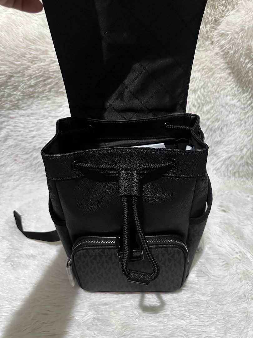 MK cooper slingpack monoblack (Category: Luxury Bags & Wallets) located in Pasig City. Submitted by jackie_ginger (Listing ID 1288434029, Image 3). Description: Onhand with tag and care card 💯orig from US.