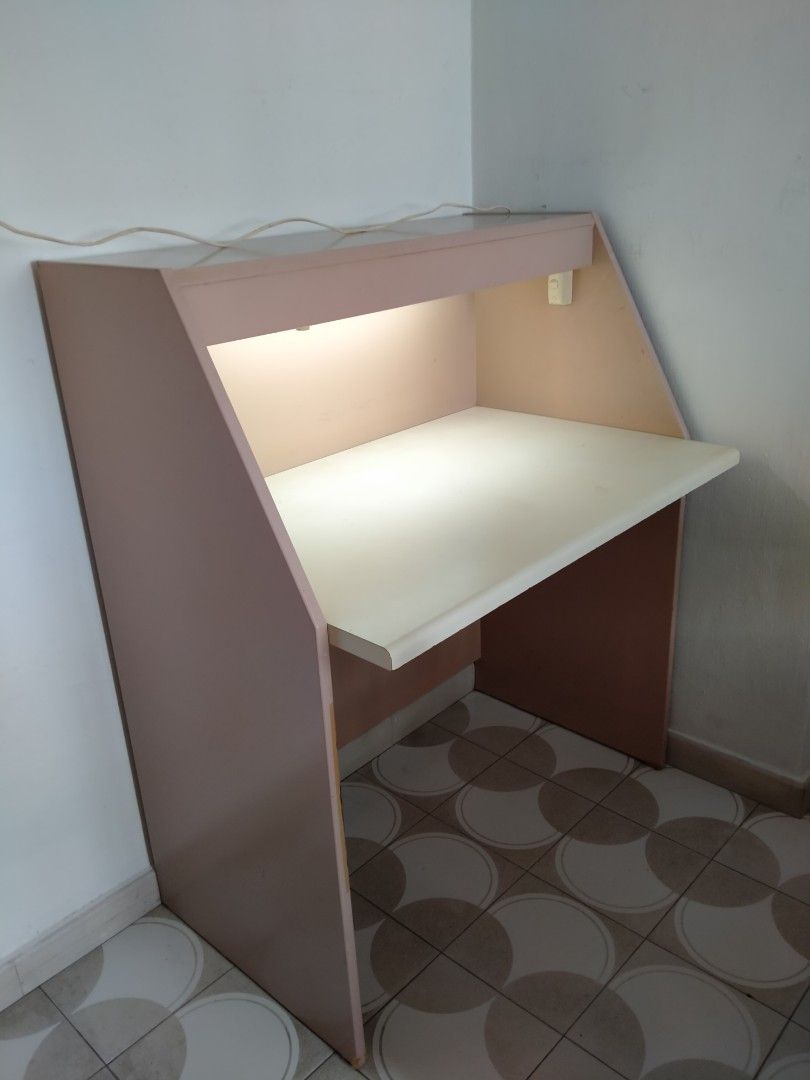 Study Table (Category: Tables & Sets) located in Singapore. Submitted by tingcn8 (Listing ID 1288254006, Image 2). Description: This is a solid study/writing table with lighting. Overall height and depth of this table is 116cm x 63cm. The table top is 76cm high. The writing surface is 93cm x 60.5cm. Minor flaw at bottom of both sides of table support, as shown in the picture. Self collect, if interested..