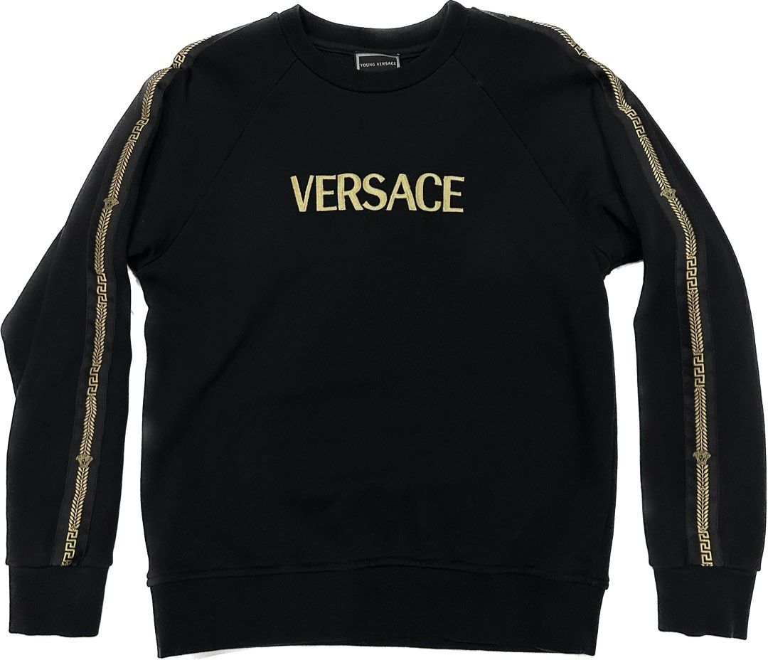 Versace Cornici Side Stripe Logo (Category: Longsleeves) located in Quezon City. Submitted by ishdeclutters (Listing ID 1288360725, Image 1). Description: Condition: 9.2/10 Color: Black & Gold Size: XS - S Womens / Teens L Ribber crew neck, long sleeves, ribbed hem & cuffs Brand Style ID: YVMFE168YFE130.