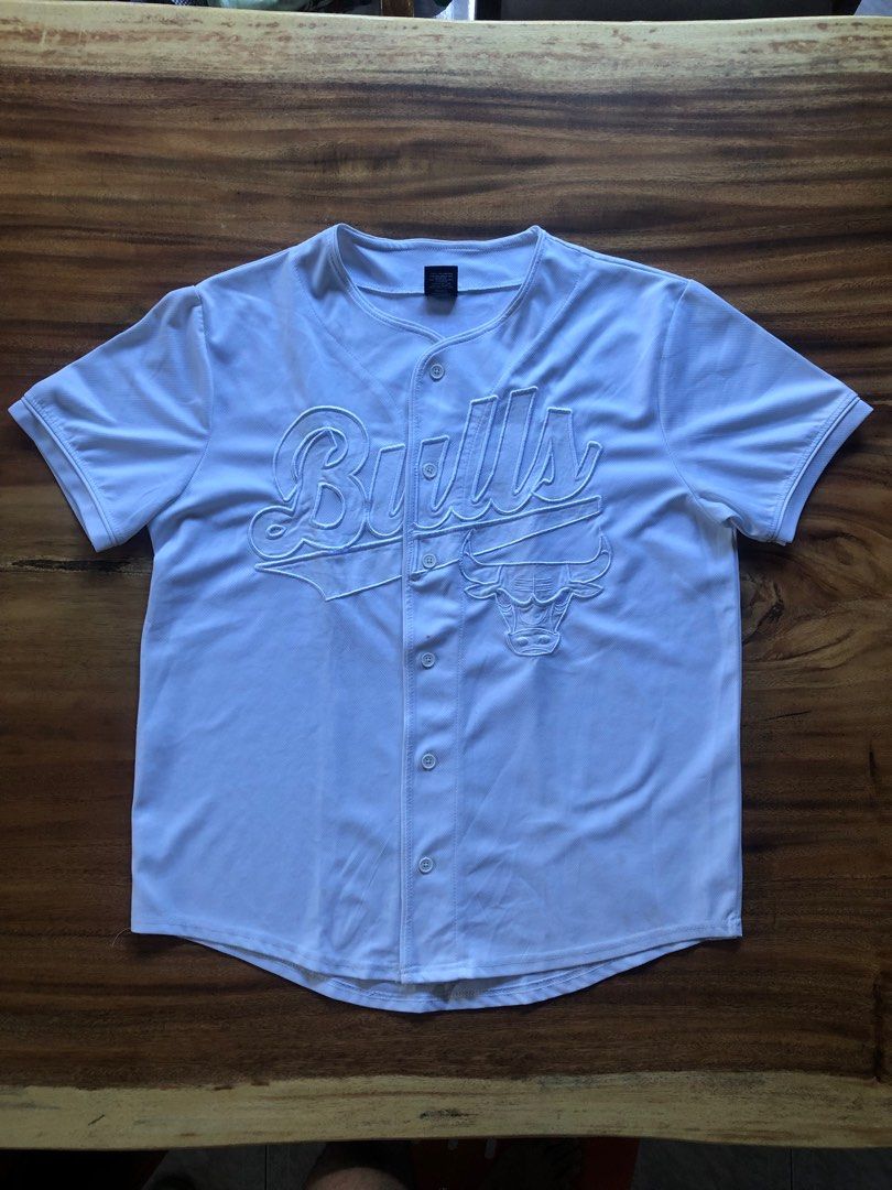 Vintage Chicago Bulls Baseball Tee (Category: Tshirts & Polo Shirts ) located in Pasig City. Submitted by maplemart (Listing ID 1288252537, Image 2). Description: Vintage Chicago Bulls Baseball Tee - 23 x 27.5 - Tagged L - Embroidered Bulls spellout and Bulls logo in the front, #66 tagged at the back - Very nice retro piece! - Theres a small red stain near the buttons (havent really tried removing this though) and washable dirt near the bottom - 