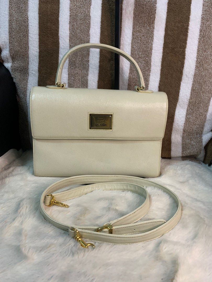 Auth moschino 2way vintage leather bag (Category: Luxury Bags & Wallets) located in Cabanatuan. Submitted by mjluxxejapan (Listing ID 1288628074, Image 1). Description: No lp pls.genuine leather.off white color.good condition.2way crossbody.super pretty.small sz approx 10”x7.5”meas.