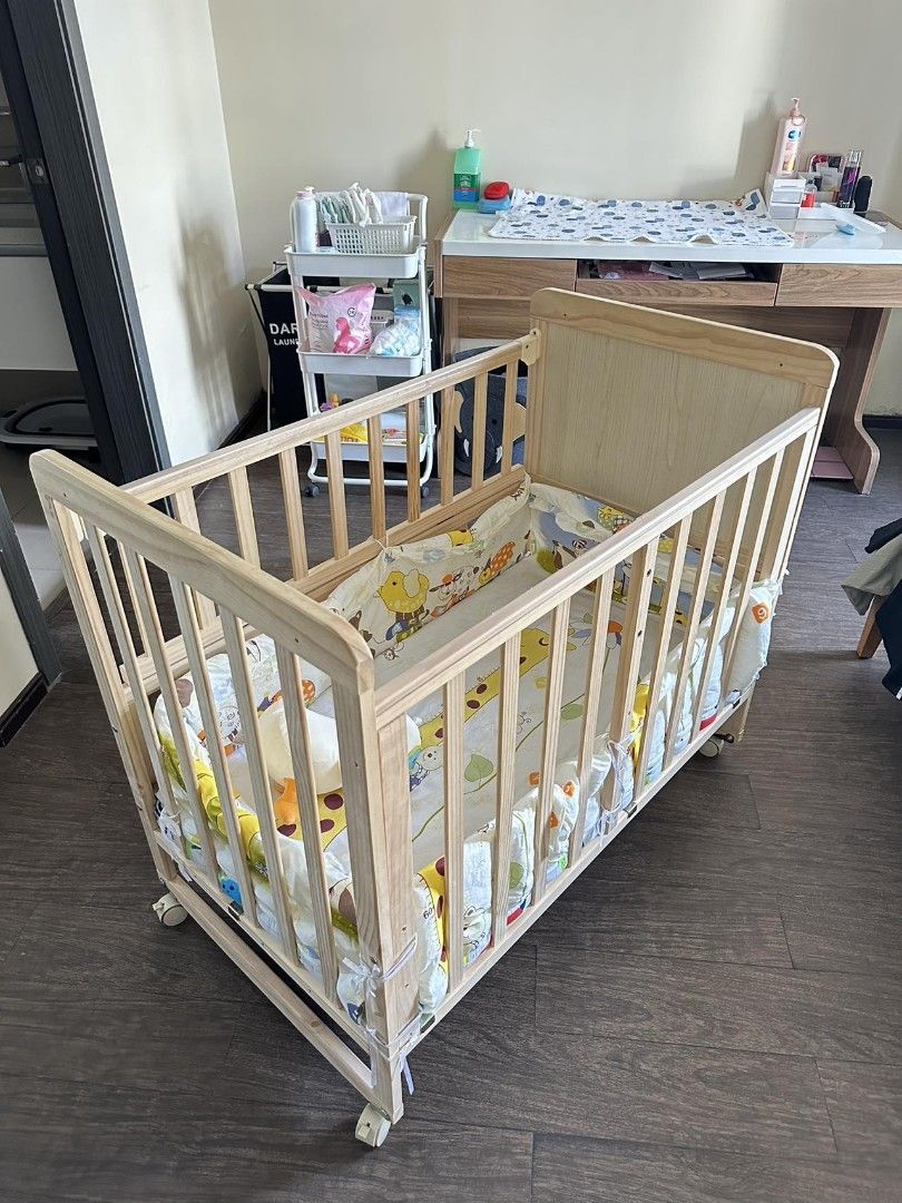 Cot with best sale sliding side