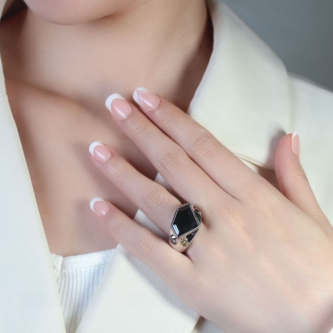White gold ring deals with black stone