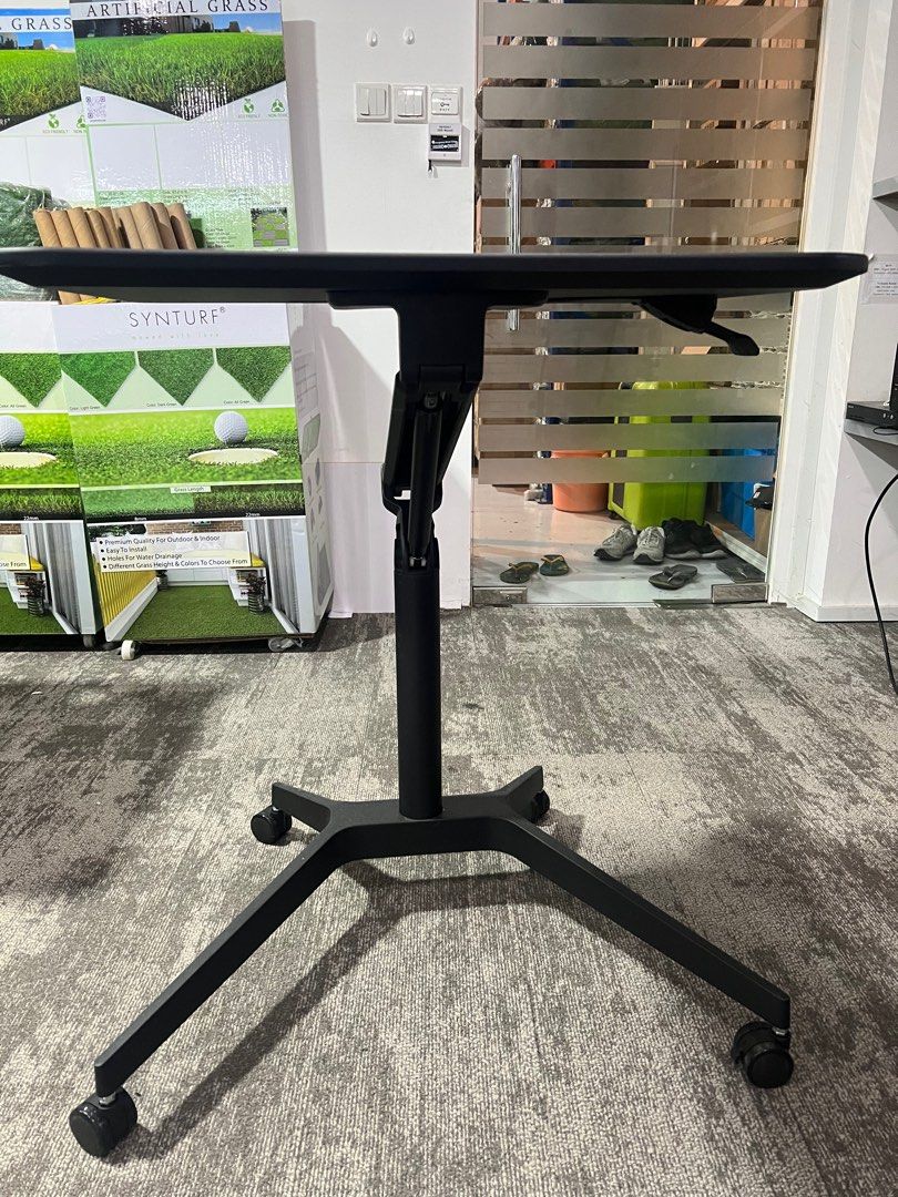 Adjustable Table (Category: Tables & Sets) located in Singapore. Submitted by lingche22 (Listing ID 1288783007, Image 2). Description: It is a light used table but got scratches on the top Adjustable height from 75cm - 106cm.
