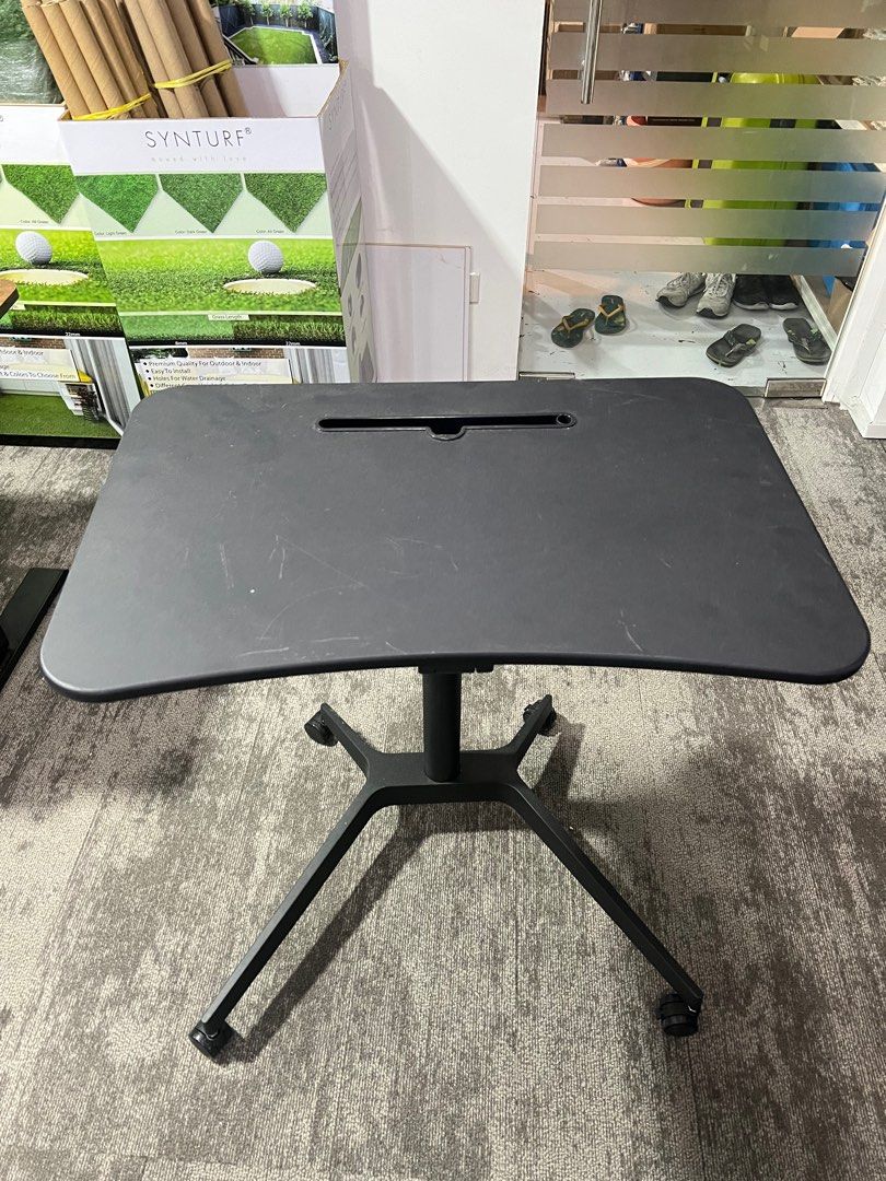 Adjustable Table (Category: Tables & Sets) located in Singapore. Submitted by lingche22 (Listing ID 1288783007, Image 1). Description: It is a light used table but got scratches on the top Adjustable height from 75cm - 106cm.