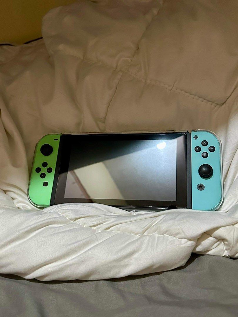 Nintendo Switch V2 Animal crossing Special Edition (Category: Nintendo) located in Baguio. Submitted by stufza (Listing ID 1288837813, Image 1). Description: GREAT CONDITION‼️ Nintendo Switch V2 Animal crossing Special Edition Including ALL Original accessories and BOX FREEBIE‼️ Tempered Glass installed Acrylic Case Cartridge Holder PRICE : 11,000 Meet up, Gcash, BDO Loc: La Union / Baguio City.