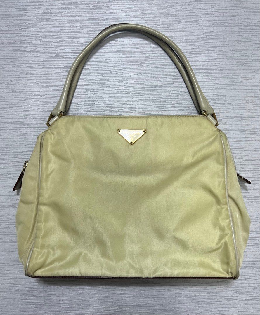 Vintage Prada Tessuto Nylon Hand Bag (Category: Luxury Bags & Wallets) located in Manila. Submitted by greatergoodph (Listing ID 1288778476, Image 1). Description: Want to Sell: Vintage Prada Tessuto Nylon Hand Bag Rank B Flaws: Creases, Dirt, Small paint chips on the handle. *Will send detailed pic upon request No Inclusion Measurements: Width: 10” Height: 8” Depth: 8”.