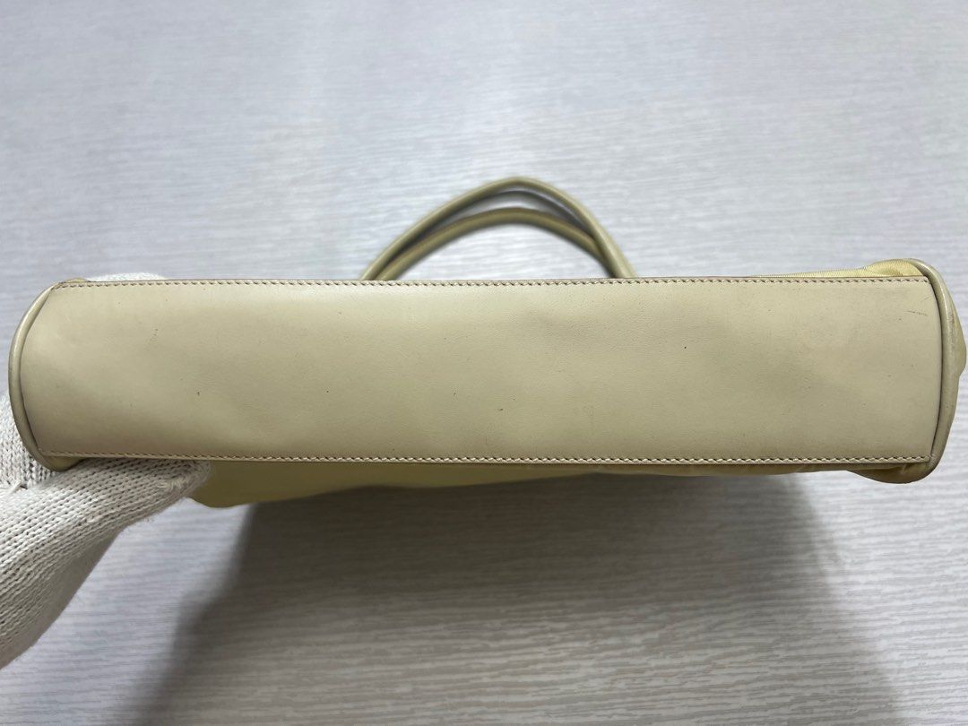 Vintage Prada Tessuto Nylon Hand Bag (Category: Luxury Bags & Wallets) located in Manila. Submitted by greatergoodph (Listing ID 1288778476, Image 3). Description: Want to Sell: Vintage Prada Tessuto Nylon Hand Bag Rank B Flaws: Creases, Dirt, Small paint chips on the handle. *Will send detailed pic upon request No Inclusion Measurements: Width: 10” Height: 8” Depth: 8”.