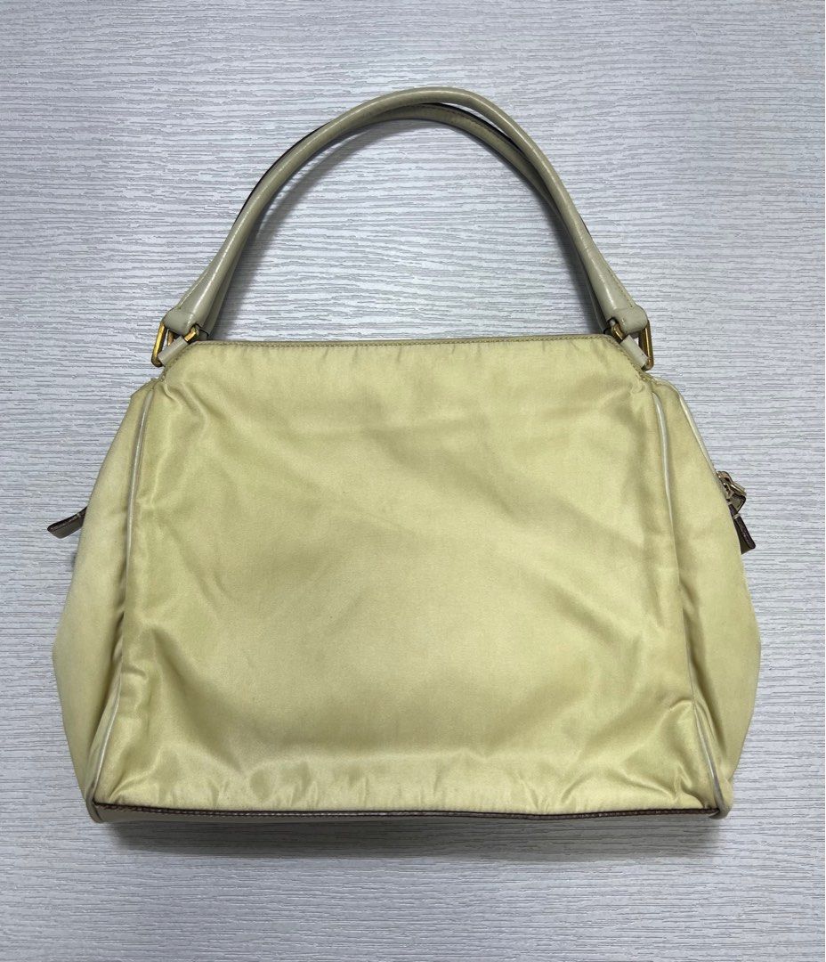 Vintage Prada Tessuto Nylon Hand Bag (Category: Luxury Bags & Wallets) located in Manila. Submitted by greatergoodph (Listing ID 1288778476, Image 2). Description: Want to Sell: Vintage Prada Tessuto Nylon Hand Bag Rank B Flaws: Creases, Dirt, Small paint chips on the handle. *Will send detailed pic upon request No Inclusion Measurements: Width: 10” Height: 8” Depth: 8”.