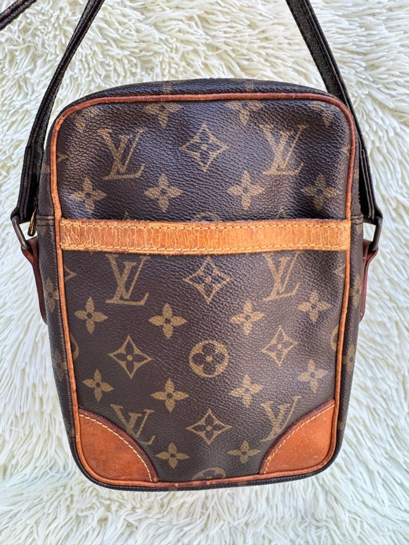 Bundle❣️LV Danube & Givenchy Wallet (Category: Luxury Bags & Wallets) located in Las Pinas. Submitted by Le.Pattie.Luxe (Listing ID 1288977516, Image 3). Description: 🎉Bundle Sale🎉 Vintage LV Danube + Free Givenchy Long Wallet 🖤Php 15k for both🖤 ▪️With signs of wear on the vachetta but monogram canvass still intact ▪️Peeling on the INTERIOR pocket ▪️Side chaps/side holder professionally replaced ▪️Both authenticated by B101Revue (see last pho