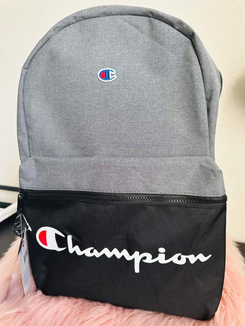 Champion Manuscript Backpack (Category: Backpacks) located in Quezon City. Submitted by jaboutique (Listing ID 1289065169, Image 1). Description: Product details: Fabric type: 100% Polyester Care instructions: Machine Wash Origin: Imported Front zip pocket Internal organizer Side water bottle pocket Slip laptop sleeve Padded strap and back Embroidered logo patch PACKAGING DETAILS: Product does not come in its original brand box and original brand