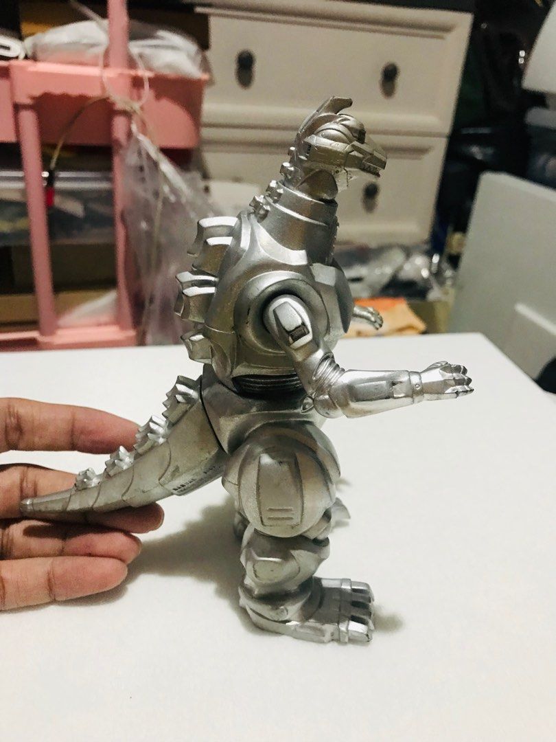 Godzilla movie MechaGodzilla (Category: Figurines & Statues) located in Las Pinas. Submitted by All.here_OnlineShop (Listing ID 1289106908, Image 2). Description: Godzilla movie MechaGodzilla 1993 Bandai release. No missing parts. 6-6.5 inches in height. 850 only. Shipping via LBC or JRS (Provincial) Lalamove (same day delivery within Metro Manila). Items are coming from Las piñas. *items are considered sold and given in good condition unless oth