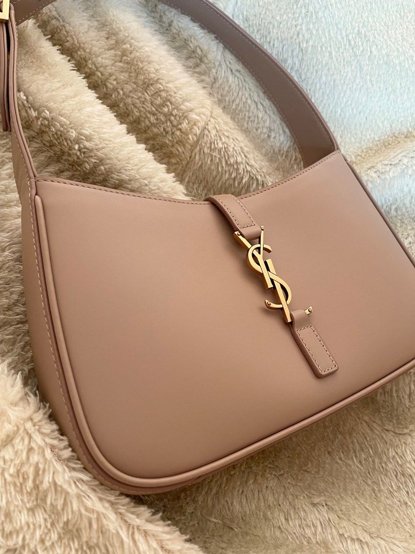 YSL Kili Bag (Category: Luxury Bags & Wallets) located in Tagaytay City. Submitted by verycutesy8 (Listing ID 1289089574, Image 3). Description: YSL hobo kili bag in Beautiful Pinkish Beige color, suede interior, adjustable straps, has serial code, comes with dustbag and cards. Selling it for a steal price. All actual photos are uploaded. No returns, No exchange, No refunds..